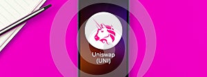 Uniswap UNI symbol. Trade with cryptocurrency, digital and virtual money, banking with mobile phone concept. Business