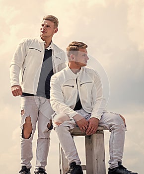 unite. confident casual models. twins brother in white. male beauty and fashion.