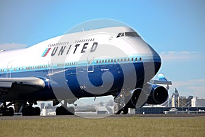 United Airlines Boeing 747 on runway.