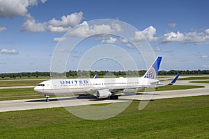 United Airlines Boeing 767-322 with the aircraft registration N641UA.is taxiing for take off on the northern runway 08L of Munich