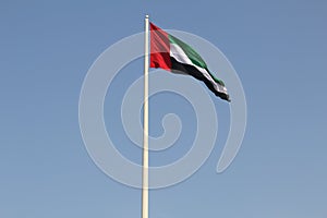 United Arab Emirates Flag isolated with blue sky