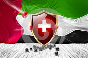 United Arab Emirates flag with Metal Shiny red shield. virus protection, hygiene shield. virus Vaccine Protection aganst
