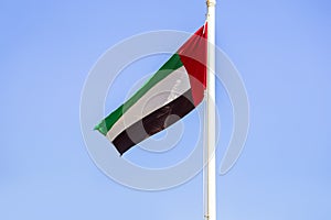 United Arab Emirates flag on the sky