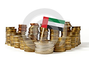 United Arab Emirates flag with stack of money coins