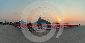 United Arab Emirates Flags, Jumeirah Public Beach, Jumeirah Marsa Al Arab Hotel and Burj Al Arab Hotel at Sunset