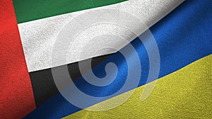 United Arab Emirates and Ukraine two flags textile cloth, fabric texture