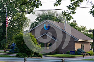 A United Bank store with USA flag for finance services and drive through convenience