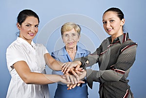 United business women with their hands together