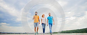 United group purposefully moves forward. Friendship tested for years. Men and woman walks dramatic cloudy sky background