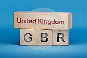 United Kingdom and GBR symbol. Concept words United Kingdom and GBR on wooden blocks. photo