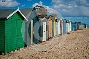 2016 United Kingdom Mersea colorful houses on the coast. Beautiful wide beach with interesting buildings