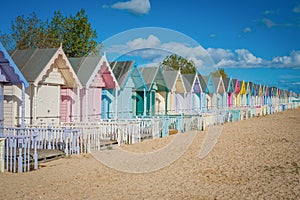 2016 United Kingdom Mersea colorful houses on the coast. Beautiful wide beach with interesting buildings