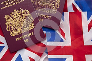 United Kingdom travel passport on a Great Britain Union Jack flag