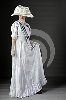 United Kingdom Victorian or Edwardian Suffragette with historically accurate sash and rosette photo