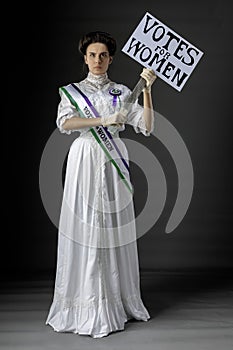 United Kingdom Victorian or Edwardian Suffragette with historically accurate sash and rosette photo