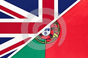 United Kingdom vs Portugal national flag from textile. Relationship between two european countries