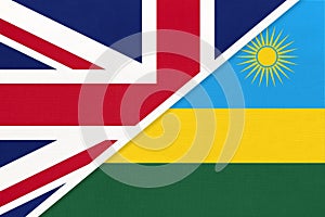 United Kingdom vs Rwanda national flag from textile. Relationship between two European and African countries photo