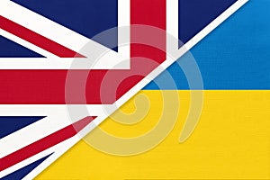 United Kingdom vs Ukraine national flag from textile. Relationship between two european countries