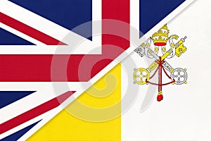 United Kingdom vs Vatican City national flag from textile. Relationship between two european countries