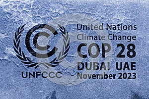 The United Nations Flag, logo of Climate Change UNFCCC on a grungy cracked wall. COP 28 Dubai, UAE