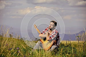 United with nature. Musician looking for inspiration. Dreamy wanderer. Peaceful mood. Guy with guitar contemplate nature