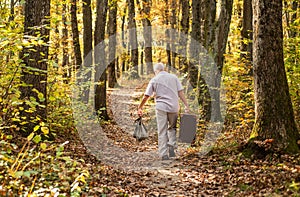 United with nature. Weekend in nature. Vacation and relax. Retirement concept. Elderly people. Mature man with white