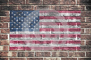 United States of America flag stars and stripes old glory on brick wall background