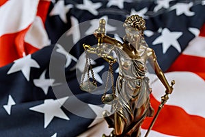 United States of America, statue of Lady Justice with USA flag