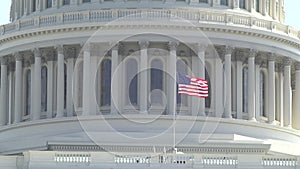 United States Capital - Close-up of the American Flag flying in the wind on the Capital Building