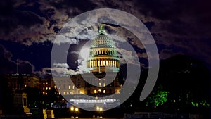 United States Capitol Building at full moon over sky at night Washington, DC, USA