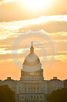 United States Capitol building silhouette at sunrise, Washington DC