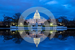 The United States Capitol with reflection at night, Washington DC photo