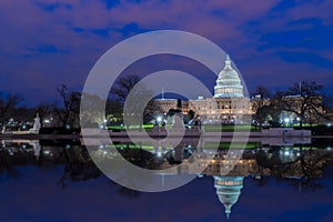 The United States Capitol with reflection at night, Washington DC, USA
