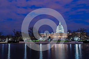 The United States Capitol with reflection at night, Washington DC, USA photo