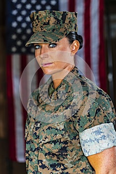 A United States Female Marine Posing In A Military Uniform