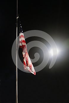 United States Flag at Half Mast at Night