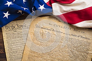 United States founding documents on a vintage American flag