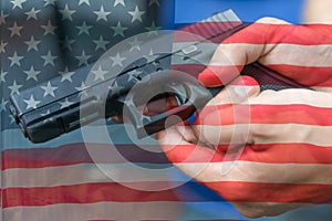 United States Gun Laws - Guns and weapons. A hand of man practicing firing using a Glock gun model at the shooting range. Fire