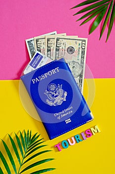 United States passport with us dollars and airplane ticket, tourism concept