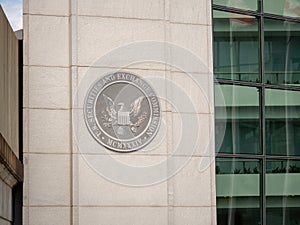 United States Securities and Exchange commission SEC logo on entrance of DC building near H street