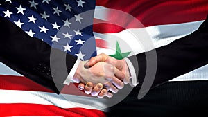 United States and Syria handshake, international friendship, flag background