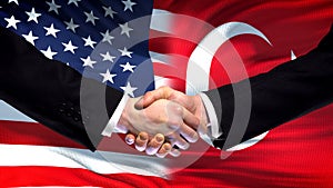 United States and Turkey handshake, international friendship, flag background