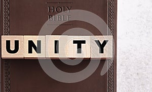 Unity Spelled in Blocks on a Leather Holy Bible