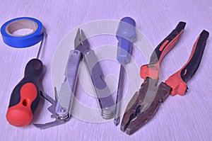 universal construction tool screwdriver pliers electrical tape