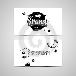 Universal monochrome design template business card with abstract brush strokes and ink spot designs.