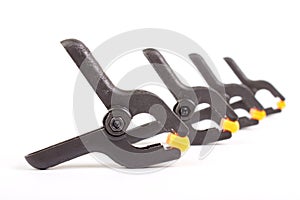 Universal plastic black-orange clamp isolated