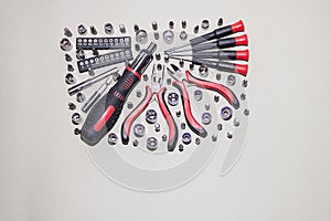 A universal set of screwdrivers with replaceable nozzles on a light white background.