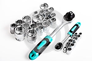 Universal socket set white background . Crafts and repair. Knob for socket wrench nut ratchet close up. Steel