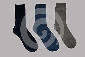 Universal warm socks on grey background.