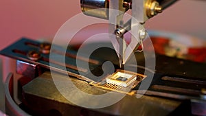 Universal wire bonder microelectronic equipment in work close-up